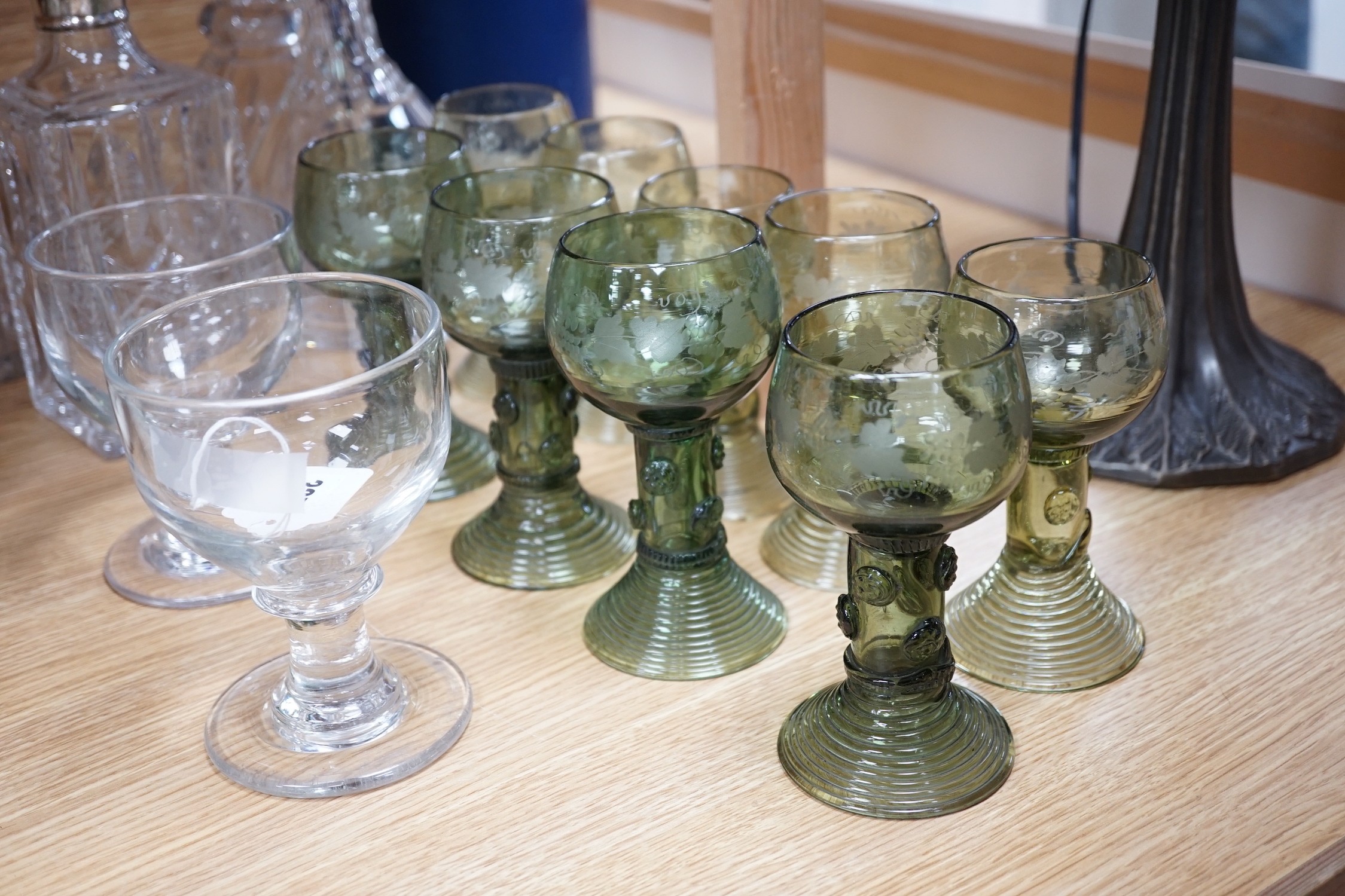 A pair of rummers, three glass decanters, a silver mounted decanter and nine etched green glass goblets, tallest 34cm